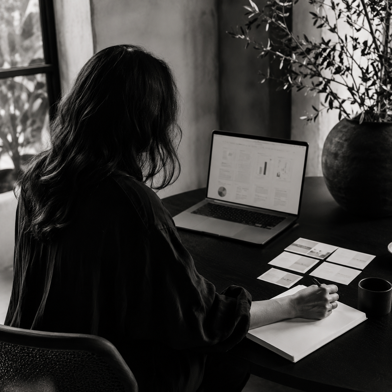 Marketing strategist reviewing campaign analytics and planning a tailored customer journey.